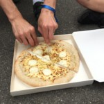 Vending machine pizza with goat cheese and honey and a little wooden knife. Really tasty, certainly way better than expected!