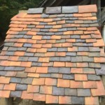 Display of tiles. The colours vary depending on where in the kiln the tile was placed, and therefore the varying temperature.