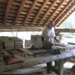 The tilemaker. He pressed clay into a frame to get the shape.