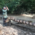 Next step of making a beam, using a side-axe to cut off the pieces between the chunks. This method helped keep the beam a consistent width, but also followed the grain of the wood which kept it stronger.