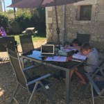 Schoolwork outside in the shade.